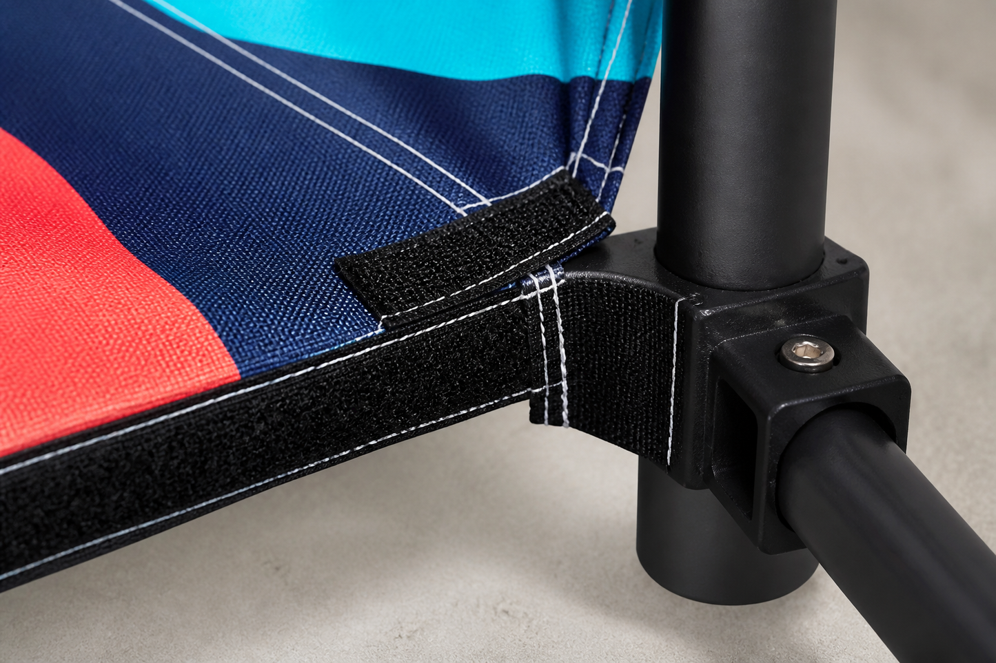 Close-up of 600D printed canopy fabric, reinforced stitching and frame hardware